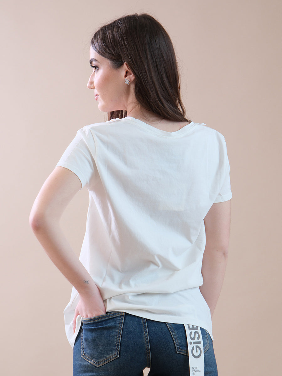 T-shirt bianca con margherite applicate al collo