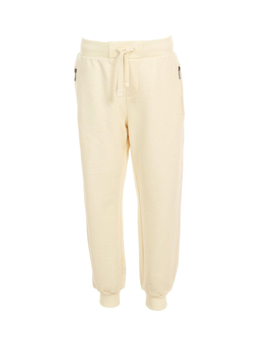 Pantalone in tuta Moschino avorio con tasche a zip e logo effetto pittura HUP08L 10123 Moschino 