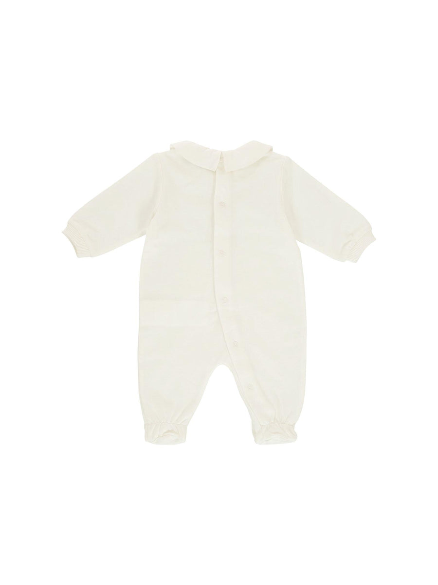 Tutina con piedini Moschino bianca con logo e teddy MUT04I 10063 Moschino 