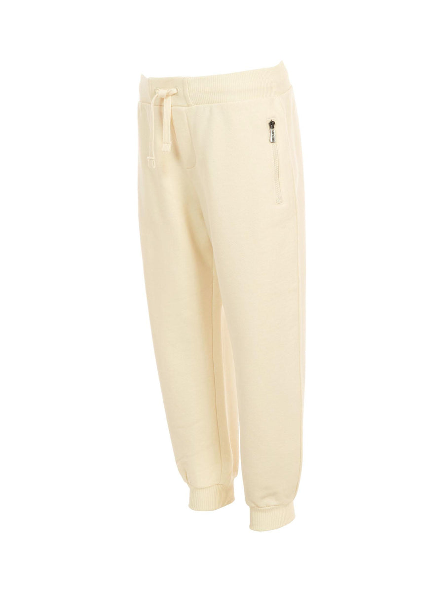 Pantalone in tuta Moschino avorio con tasche a zip e logo effetto pittura HUP08L 10123 Moschino 