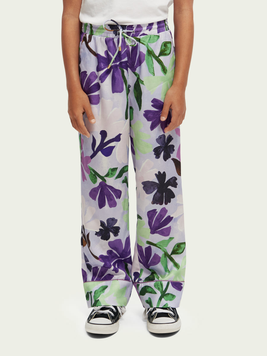 Pantalone lilla con stampa floreale